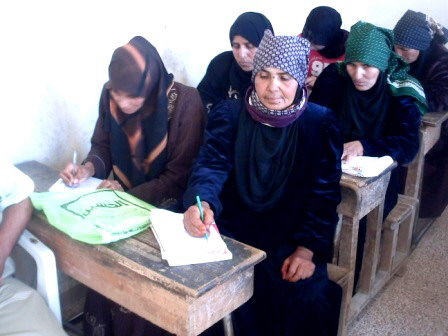 In this undated photo, Jordanian women receive education in a literacy class in a northern town  (Photo courtesy of http://kenanaonline.com)