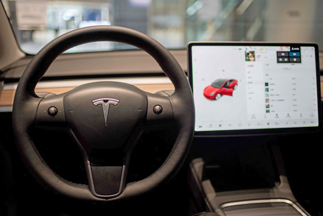 US officials are probing whether Tesla's 'passenger play' videogame function could lead to crashes, according to an online posting on Wednesday, by the National Highway Traffic and Safety Administration  (AFP file photo)