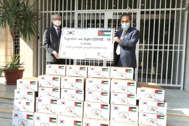 HH Prince Mired and Korean Ambassador to Jordan Lee Jae-wan pose for a photo during a handover ceremony of a donation to the Higher Council for the Rights of Persons with Disabilities at the South Korean embassy on Monday (Petra photo)
