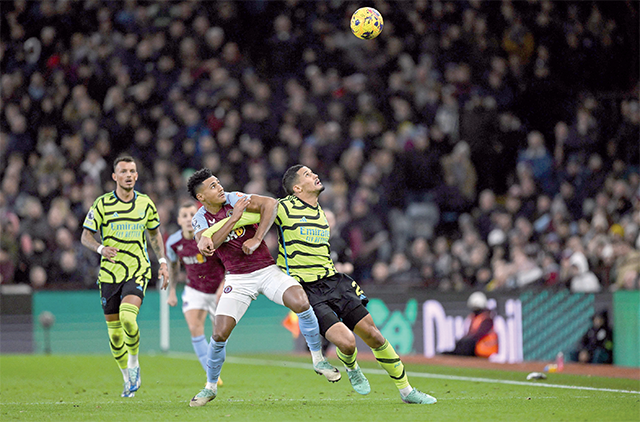 Aston Villa’s English striker #11 Ollie Watkins (left) fights for the ball with Arsenal’s French defender #02 William Saliba during the English Premier League football match between Aston Villa and Arsenal at Villa Park in Birmingham, central England on Saturday (AFP photo)
