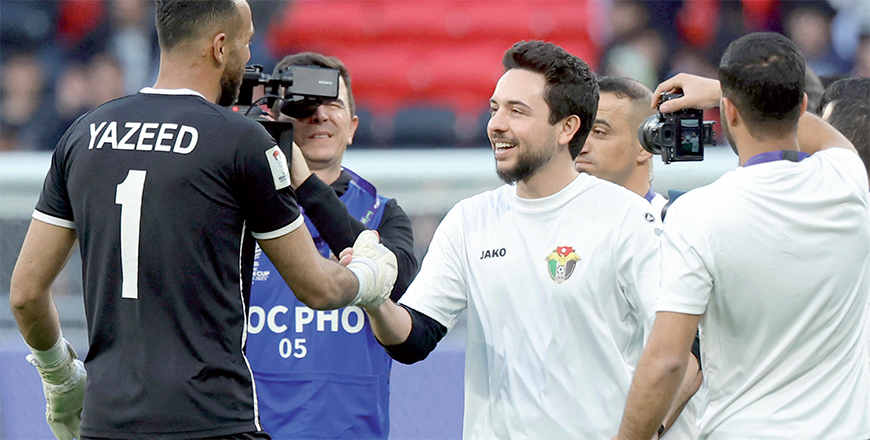 HRH Crown Prince Hussein celebrates with Jordan’s goalkeeper #01 Yazeed Abulaila after the Qatar 2023 AFC Asian Cup quarter-final football match between Tajikistan and Jordan at the Ahmad Bin Ali Stadium in Al Rayyan, west of Doha, on Friday (AFP photos)