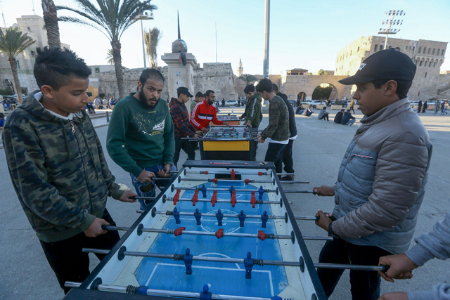 Libyans play foosball (table football) on public tables in the capital Tripoli, on February 3 (AFP photo)