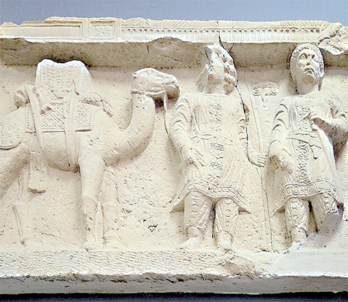 A camel caravan with a dromedar, camel herder and soldier (Photo courtesy of Palmyra Museum)