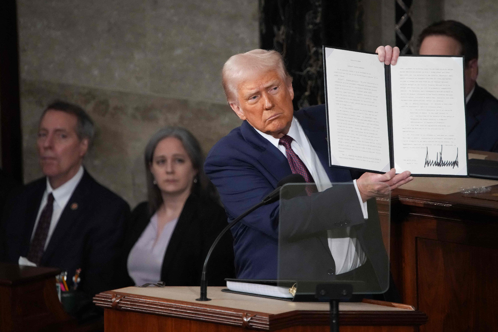 US President Donald Trump holds a copy of an executive order honoring Jocelyn Nungaray, a 12-year-old girl who was killed by illegal immigrants, as he addresses a joint session of Congress at the US Capitol on March 04, 2025 in Washington, DC (AFP photo)