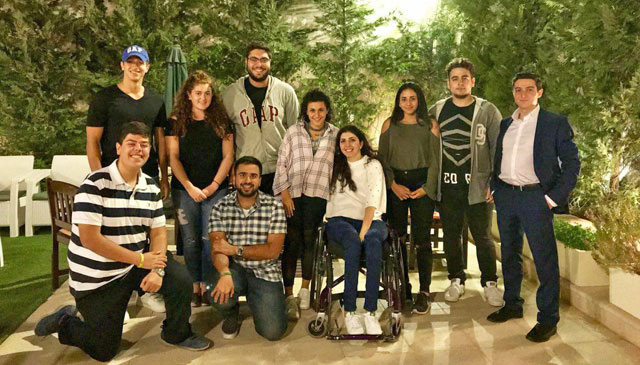 Aya Aghabi poses for a group photo with the high school and college students working to establish the NGO ‘Jordan Disability Foundation’ in Amman recently (Photo courtesy of Aya Aghabi)