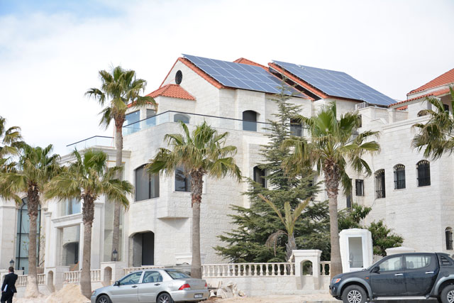 Photovoltaic panels are seen installed on the rooftop of a house in Amman recently (Photo by Amjad Ghsoun)