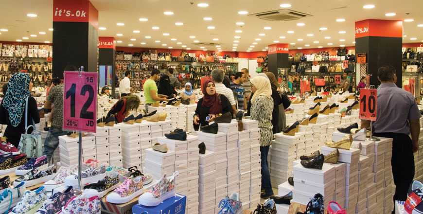 People shop for Eid at an outlet in Amman on Thursday (Photo by Amjad Ghsoun)