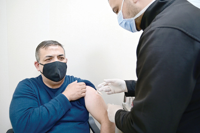 A man is seen receiving a COVID-19 jab at a vaccination centre in Amman in this file photo (JT file photo)
