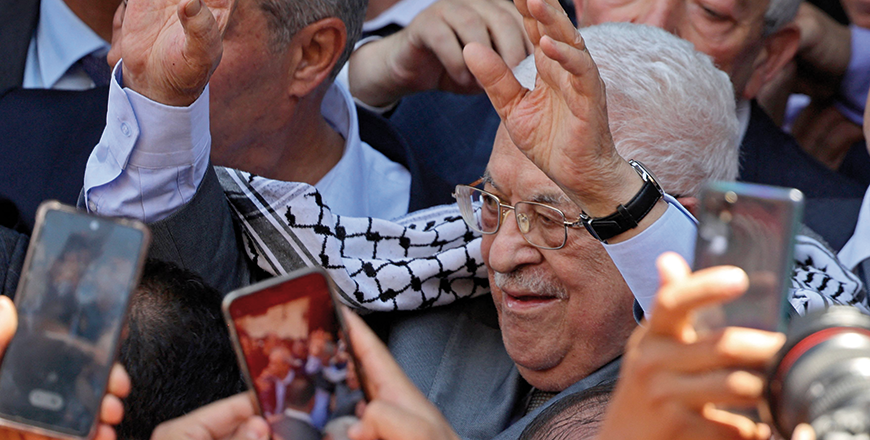 Palestinian President Mahmoud Abbas waves during a landmark visit to the Jenin camp, north of the occupied West Bank on Wednesday, a week after the largest Israeli raid there in years (AFP photo)