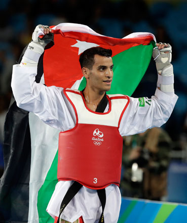 Ahmad Abu Ghaush of Jordan celebrates after winning a gold medal in the men’s taekwondo -68kg final at the 2016 Summer Olympics in Rio de Janeiro, Brazil, on Thursday (AP photo)