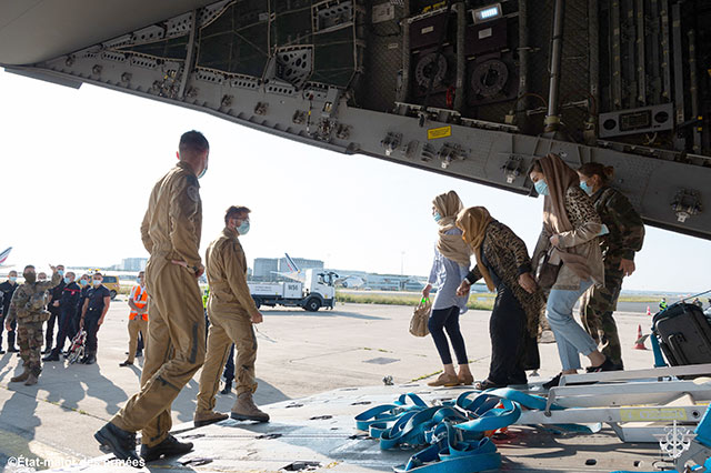 This handout photo taken and released by the French Etat-Major des Armees (Military Staff) shows people disembarking from a French Airforce 400M Atlas aircraft after being evacuated from Afghanistan as part of the operation ‘Apagan’, at the Roissy-Charles de Gaulle airport, north of Paris, on Wednesday (AFP photo)