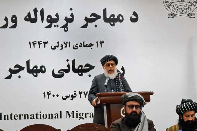 The Taliban government’s deputy foreign minister Sher Mohammad Abbas Stanekzai (top) speaks during a function to mark International Migrants Day in Kabul on Saturday (AFP photo)