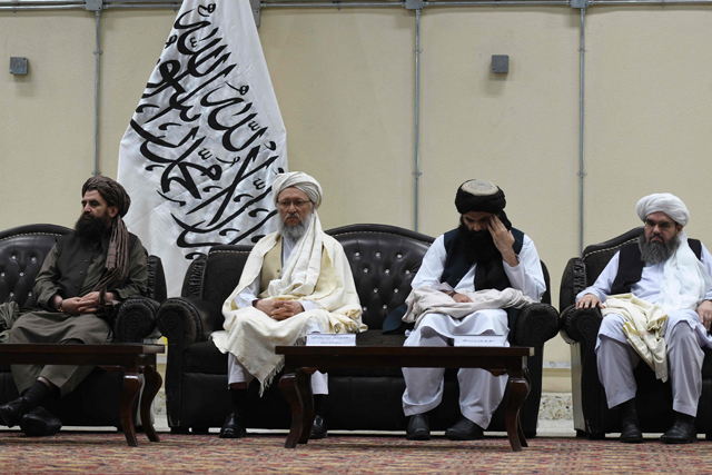 Taliban leaders participate in a conference for the reading of the official decree of the Islamic Emirate of Afghanistan’s supreme leader on the ban of poppy cultivation and all kind of narcotics, in Kabul, on Sunday (AFP photo)