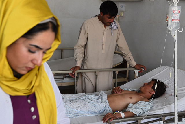 An injured man receives treatment at Ibn-e-Sina regional hospital following a bomb attack in Balkh province on Sunday (AFP photo)