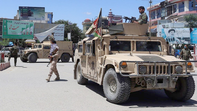 In this file photo, Afghan security forces sit in a Humvee vehicle amid ongoing fighting between Taliban militants and Afghan security forces in Kunduz (AFP photo)