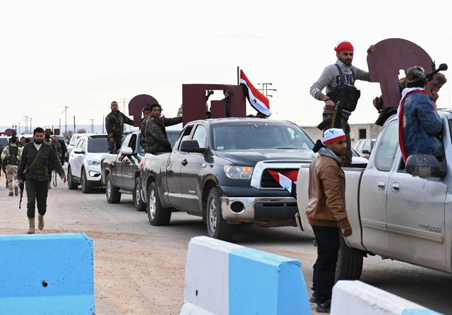This photo taken on Tuesday shows a convoy of pro-Syrian government fighters arriving in Syria's northern city of Afrin (AFP photo)