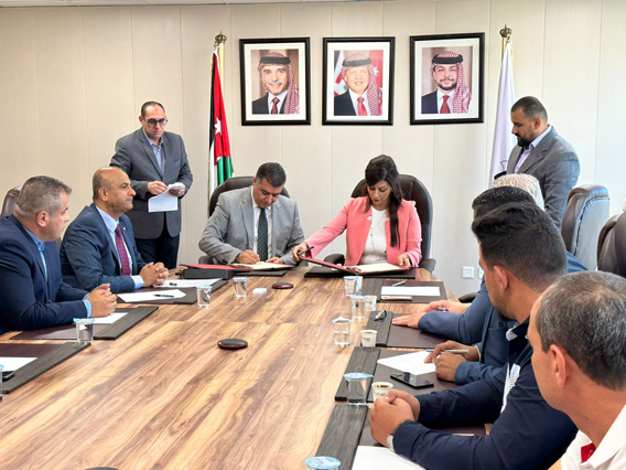 Minister of Agriculture Khalid Hneifat and officials during a signing ceremony on Thursday (Petra photo)