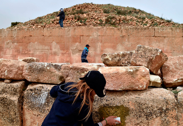 Experts and students from Algiers University’s Archaeology Institute work on one of the Jeddars pyramid tombs, near the city of Tiaret, some 250 kilometres southwest of the Algerian capital, on April 23, 2018  (AFP photo)