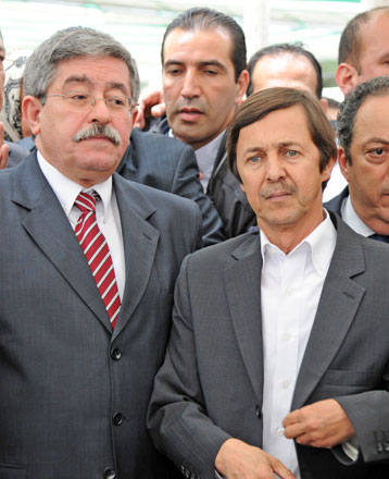 In this file photo taken on May 19, 2012, the then Algerian prime minister Ahmed Ouyahia (left) stands next to Said Bouteflika, brother of the then Algerian President, attend the funeral of late Algerian singer Warda Al Jazairia, one of the most famous singers in the Arab world, at the El Alia cemetery, in Algiers (AFP photo)
