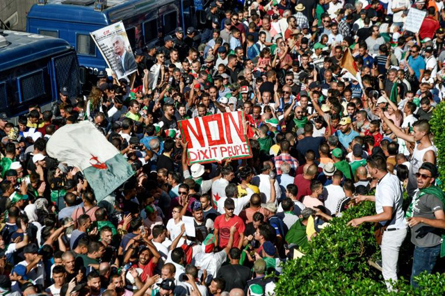 Algerian protesters have continued with their weekly mass demonstrations since President Abdelaziz Bouteflika resigned in April (AFP photo)