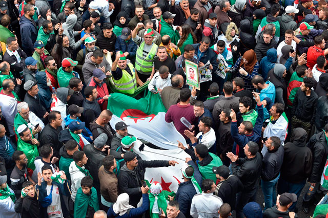 Algerian protesters march in the centre of the capital Algiers as anti-government demonstrations continue on Friday (AFP photo)