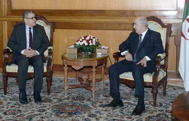 This handout photo released by the official Algeria Press Service shows Algerian President Abdelaziz Tebboune (right) meeting with the newly appointed Prime Minister Abdelaziz Djerad in the capital Algiers on Saturday (AFP photo)
