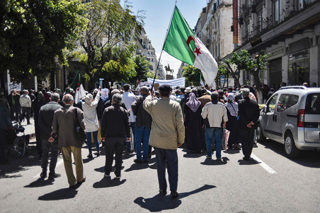   People chant slogans as they march during a student-led anti-government demonstration in Algeria’s capital Algiers, on Tuesday (AFP photo)