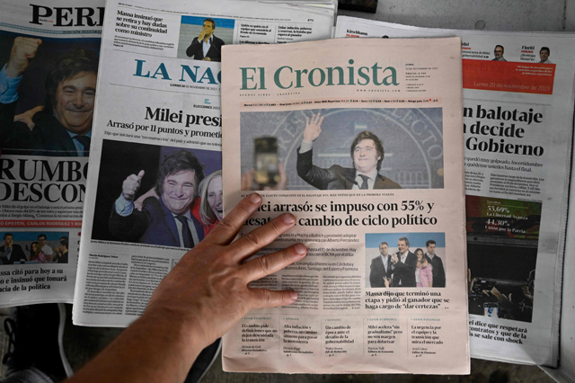 View of Argentine newspapers on Monday, in Buenos Aires, which frontpage shows the victory of the La Libertad Avanza alliance candidate Javier Milei in the presidential election run-off (AFP photo)