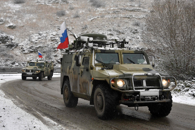 Military vehicles of the Russian peacekeeping force move on the road outside Lachin on Sunday, after six weeks of fighting between Armenia and Azerbaijan over the disputed Nagorno-Karabakh region (AFP photo)