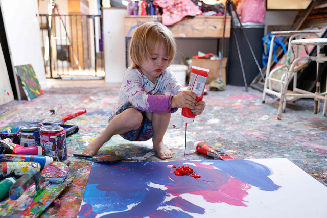 Laurent Schwarz, three years old, creates an artwork in his studio in his parents' house in Neubeuern near Rosenheim, southern Germany, on Thursday (AFP photo)