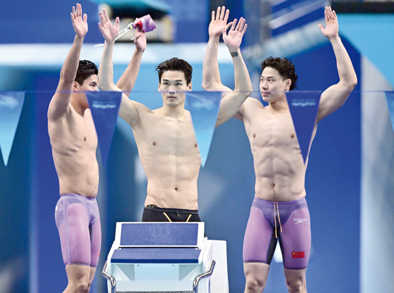 Members of team China celebrate after victory in the final of the men’s 4x100m medley relay swimming event during the Hangzhou 2022 Asian Games in Hangzhou, in China’s eastern Zhejiang province, on Tuesday (AFP photo)