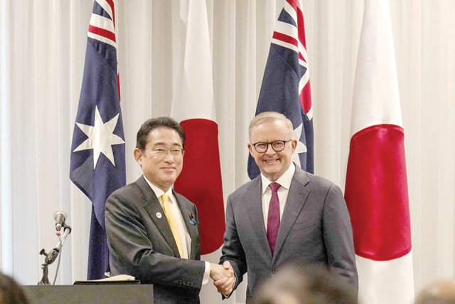 Australia's Prime Minister Anthony Albanese (right) shakes hands with Japanese Prime Minister Fumio Kishida  after a press conference as part of their meeting in Perth on Saturday (AFP photo)