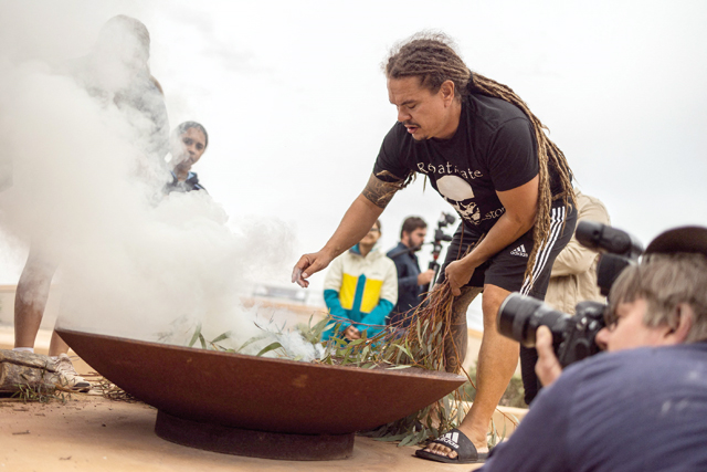 A handout photo taken and received on Wednesday from the New South Wales (NSW) Department of Environment shows Robert Kelly conducting a traditional Aboriginal smoking ceremony in the Mungo National Park (AFP photo)