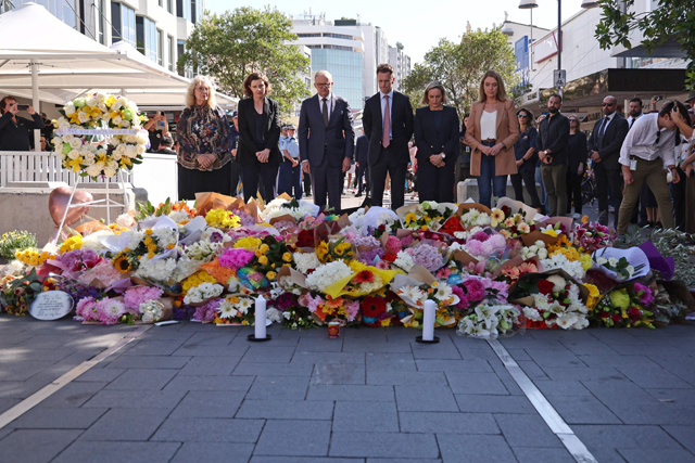 Australian Prime Minister Anthony Albanese (centre), New South Wales Premier Chris Minns (third right) and federal member of parliament Allegra Spender (second left) leave flowers with other officials outside the Westfield Bondi Junction shopping mall in Sydney on Sunday (AFP photo)