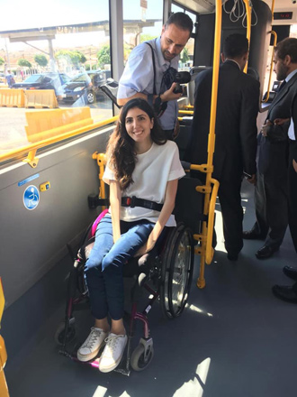   Activist Aya Aghabi is seen on the first wheelchair-accessible GAM bus in this recent photo (Photo courtesy of Accessible Jordan)