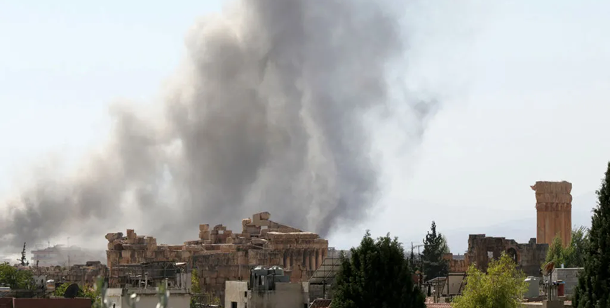 Smoke billows following an Israeli airstrike near the ruins of the ancient Roman Temple of Bacchus in Lebanon's eastern city of Baalbek in the Bekaa Valley on October 6  (AFP photo)