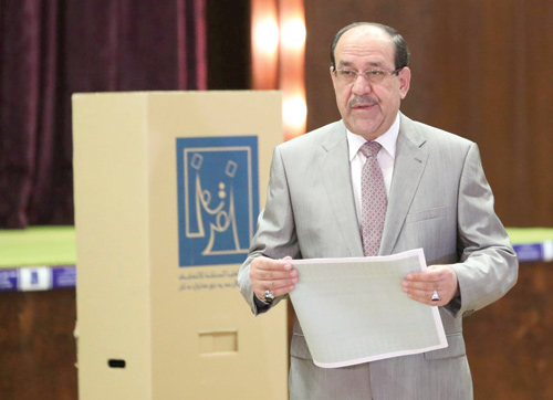 Iraqi vice president and former prime minister, Nuri A lMaliki, attends to cast his vote at a polling station during the parliamentary election in Baghdad, Iraq, on May 12 (Reuters photo)