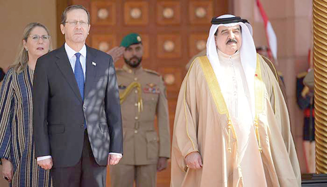 In this handout photo obtained from the Israeli Government Press Office, Bahrain's King Hamad Bin Isa Al Khalifa receives Israeli President Isaac Herzog in the capital Manama, on Sunday (AFP photo)