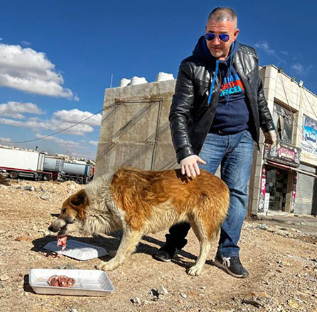 Nader Abdulraheem pictured feeding a stray (Photo courtesy of Nader Abdulraheem)