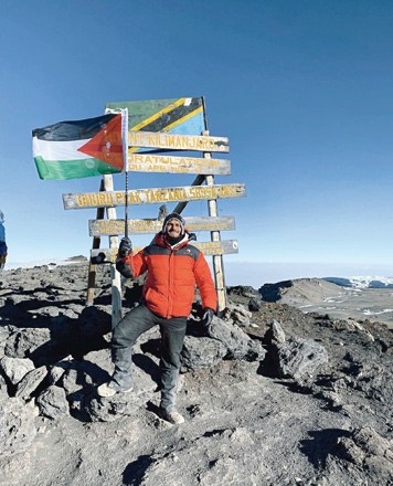 Mohammad Sabbagh poses for a photo at the summit of Mount Kilimanjaro, Tanzania, on September 9 (Photo courtesy of Mohammad Sabbagh)