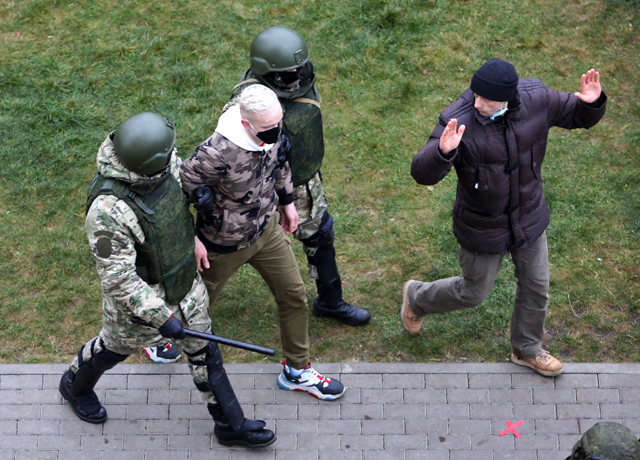 Law enforcement officers detain an opposition supporter during a rally to protest against the Belarus presidential election results in Minsk on Sunday (AFP photo)
