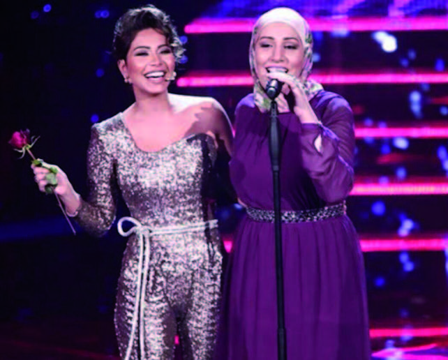  Jordanian 'The Voice' contestant Nedaa Sharara with Egyptian singer Sherine Abdel Wahab during a recent episode of the talent show (Photo courtesy of Nedaa Sharara Fans Facebook page)