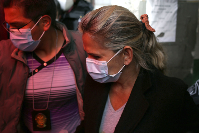 Former interim Bolivia’s President Jeannine Anez is taken to the prosecutor’s office by police members of the Special Force against Crime after being arrested in La Paz, on Saturday (AFP photo)