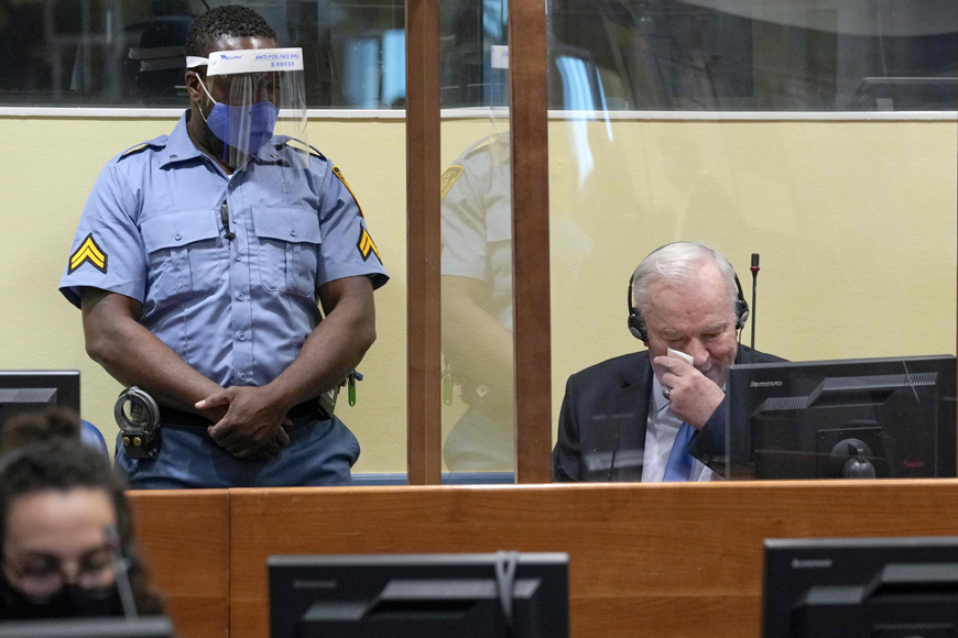 Ex-Bosnian Serb military chief Ratko Mladic wipes his face as he sits in the defendant box during the hearing of the final verdict on appeal against his genocide conviction over the 1995 Srebrenica massacre, Europe’s worst act of bloodshed since World War II, on Tuesday, at the International Residual Mechanism for Criminal Tribunals (IRMCT) in The Hague  (AFP photo)