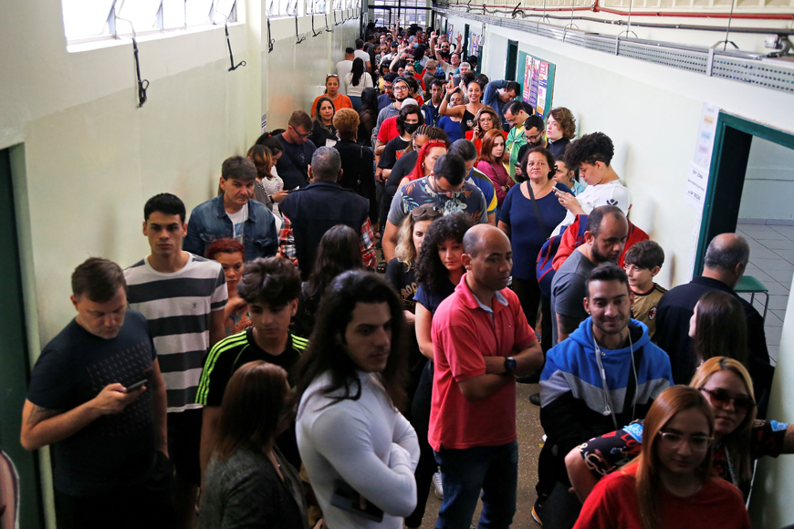 People queue to vote during the legislative and presidential election, in Sao Paulo, Brazil, on Sunday (AFP photo)