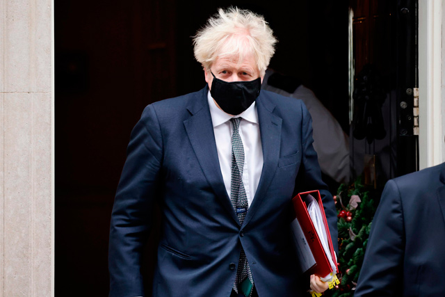 Britain's Prime Minister Boris Johnson leaves 10 Downing Street in central London, on Wednesday, to take part in the weekly session of Prime Minister Question (PMQs) at the House of Commons (AFP photo)
