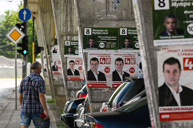A man walks past posters of the Bulgarian Socialists Party in Sofia on Thursday, ahead of the parliamentary elections (AFP photo)