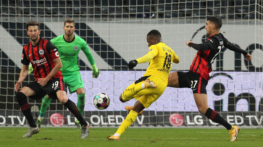 Dortmund’s German forward Youssoufa Moukoko (centre) shoots the ball during the German first division Bundesliga football match Eintracht Frankfurt - BVB Borussia Dortmund, in Frankfurt, western Germany, on Saturday (AFP photo)