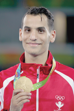 Taekwondo star Ahmad Abu Ghaush proudly shows off his gold medal after winning the taekwondo -68 kilogramme category at the Olympic Games in Rio de Janeiro on Friday (Photo courtesy of JOC News Service)