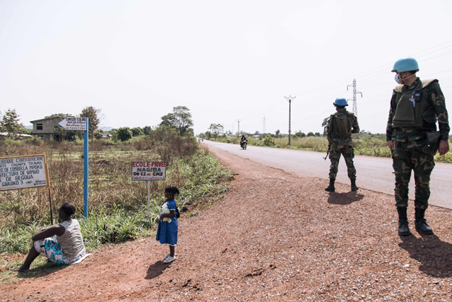 Egyptian commandos of the United Nations Multidimensional Integrated Stabilisation Mission in the Central African Republic stand guard on the National Road 1, on the outskirts of Bangui, the capital of the Central African Republic, on Friday  (AFP photo)